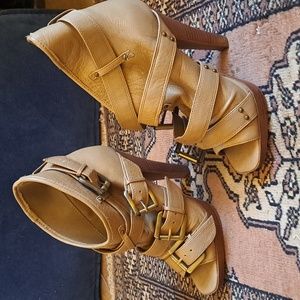 A pair of strappy Aldo beige shoes